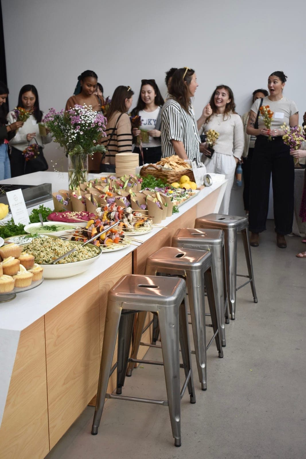 Guests gathered around a brunch spread